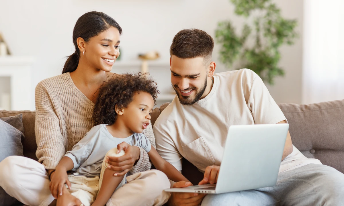 Image of a young family searching the web